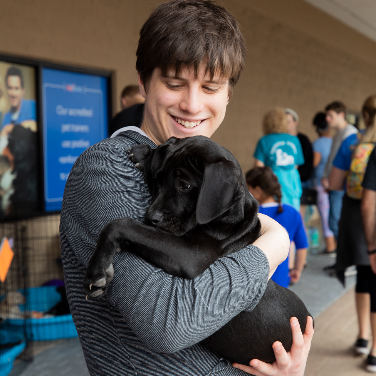 man holding small dog